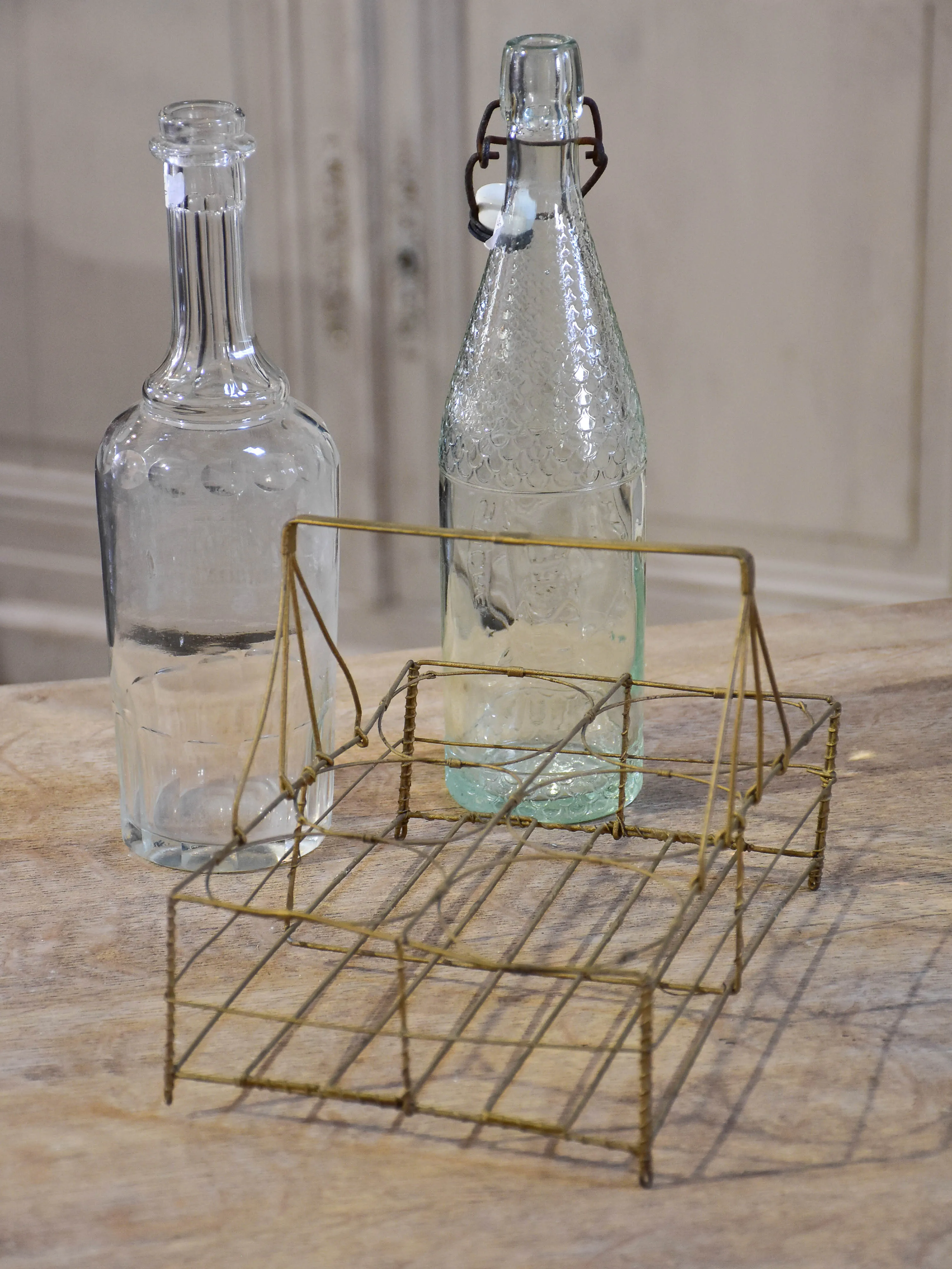 Collection of antique and vintage wire baskets and bottle carriers
