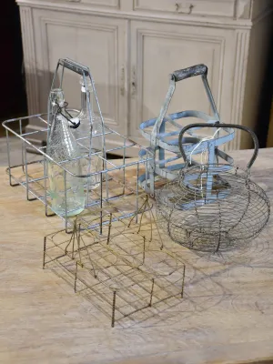 Collection of antique and vintage wire baskets and bottle carriers