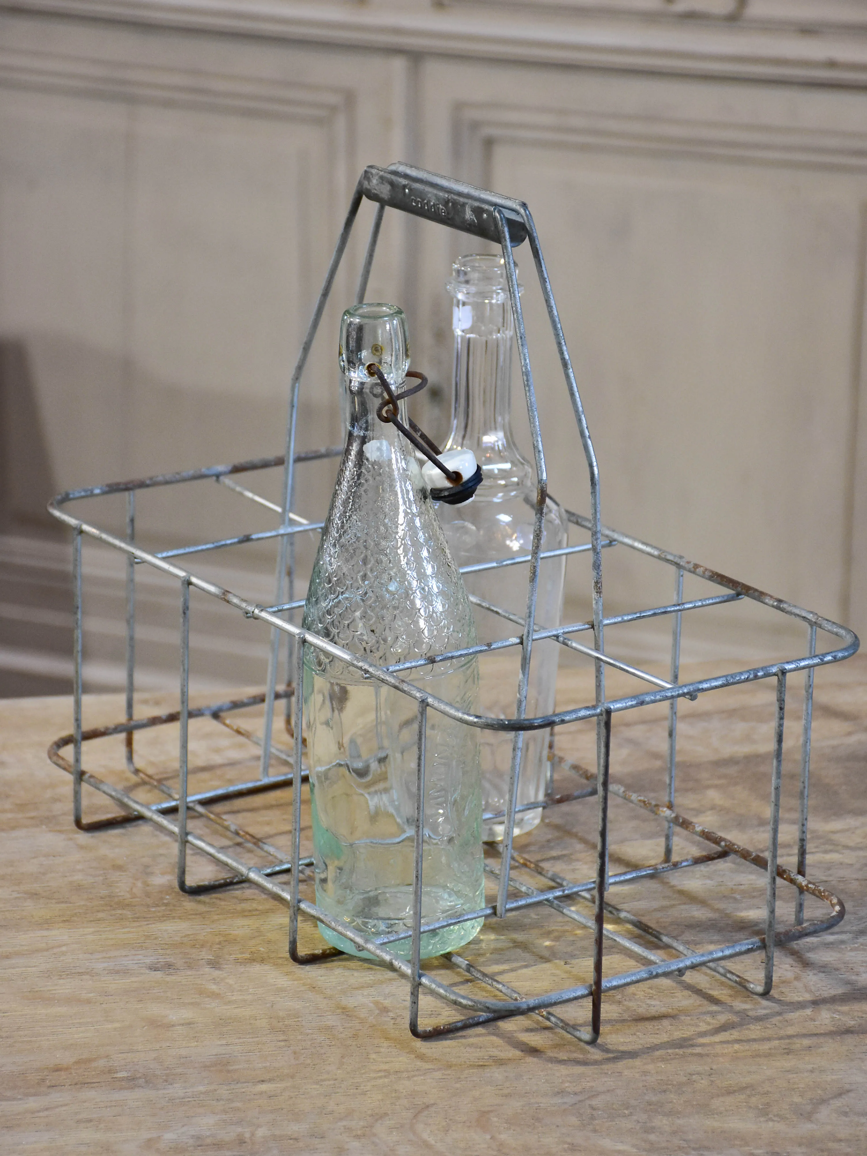 Collection of antique and vintage wire baskets and bottle carriers