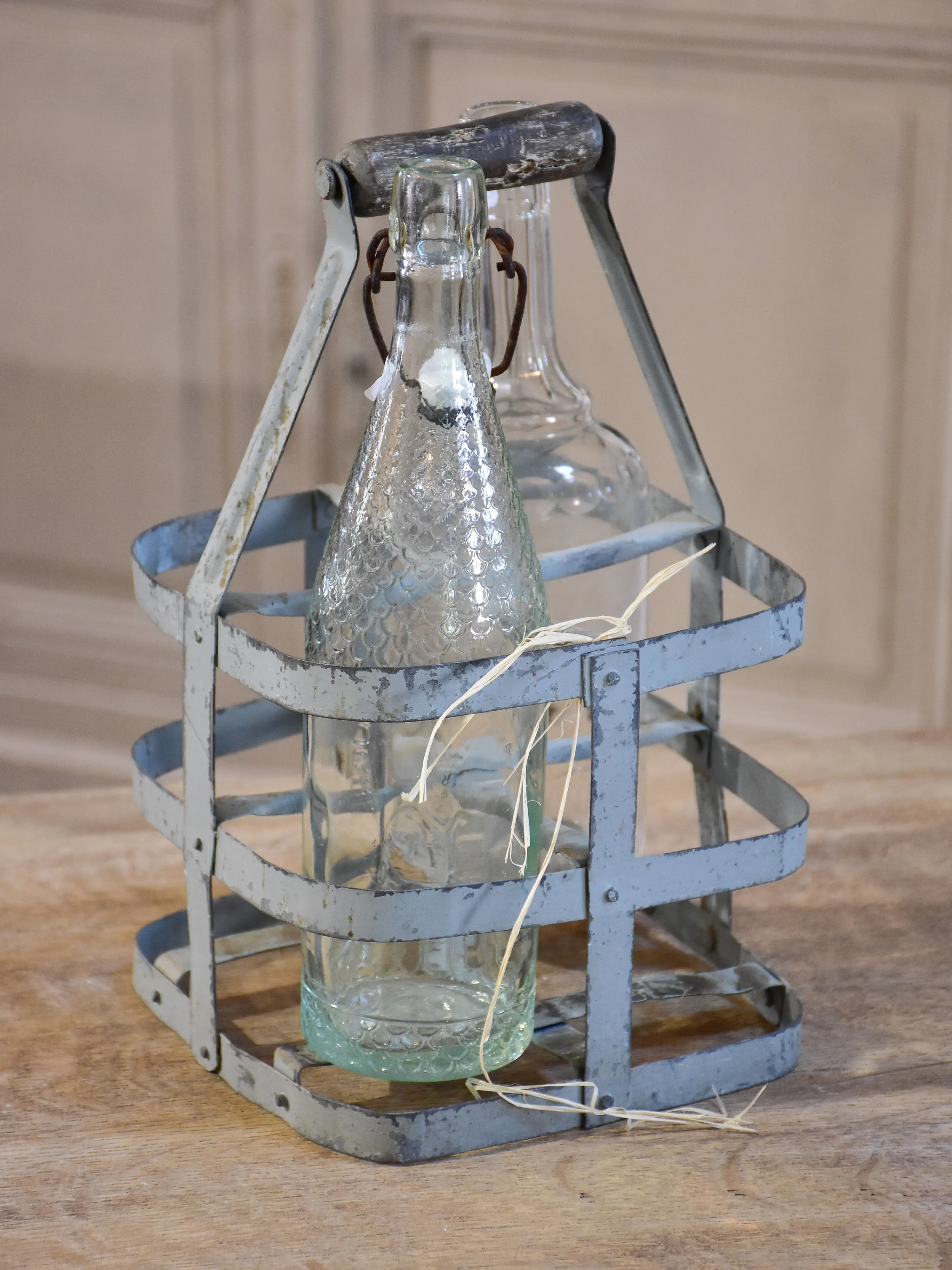 Collection of antique and vintage wire baskets and bottle carriers